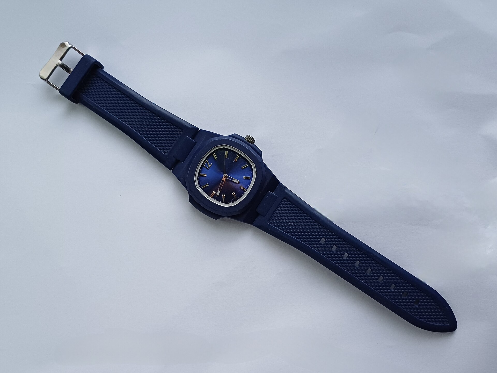 Modern wristwatch on a white background.jpg